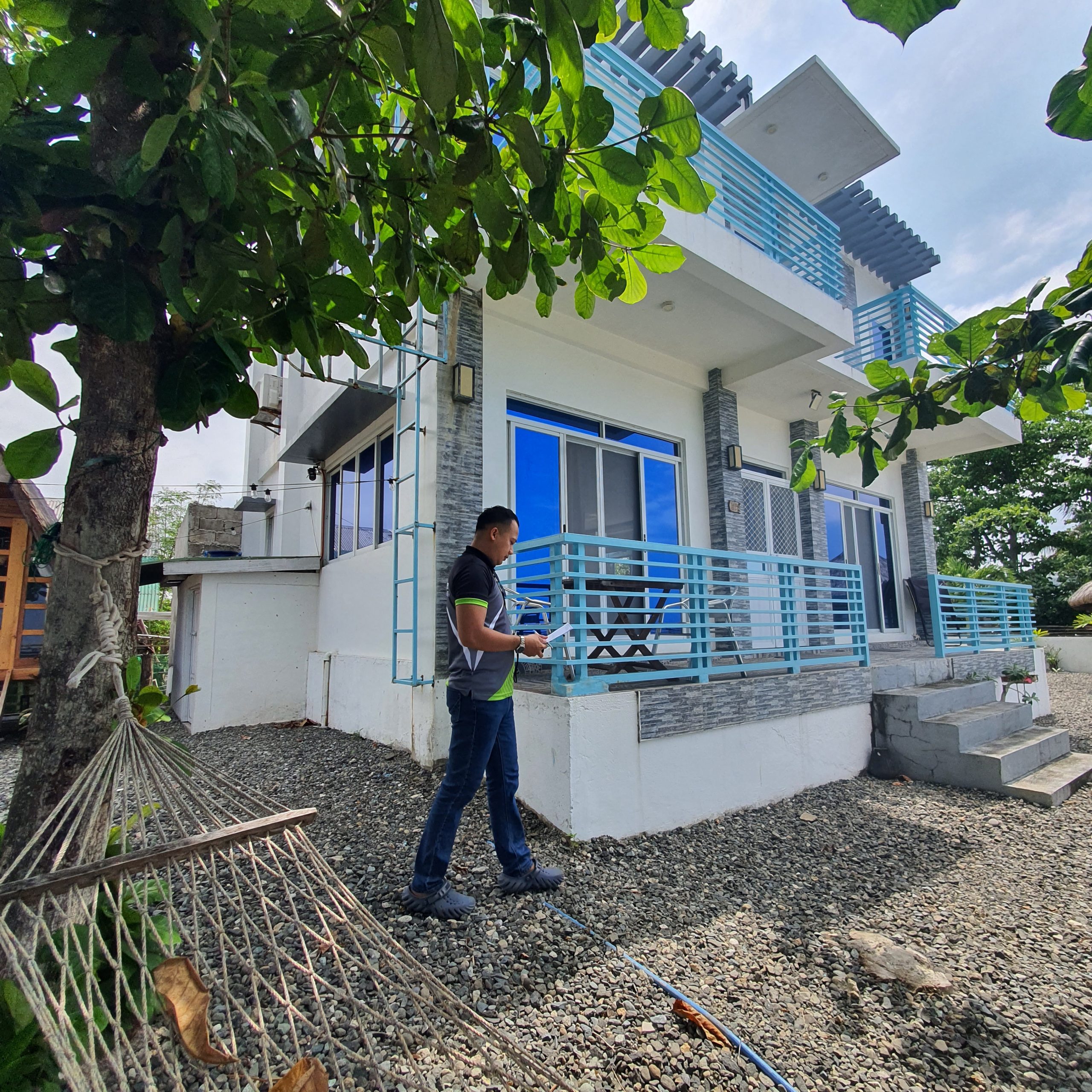 a real estate appraiser conducting property appraisal of a house